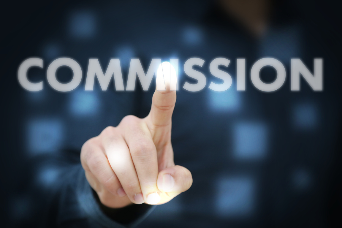 Businessperson's Hand Touching the Word Commission